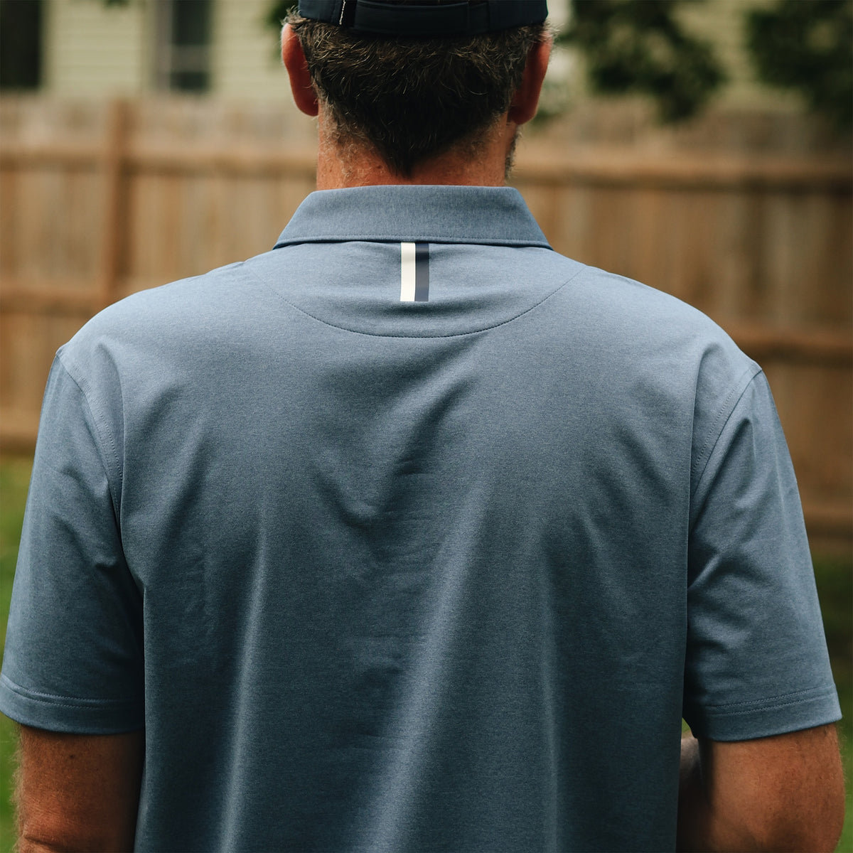NLU x Rhoback Heathered Performance Polo | Coastal Blue Tourist Sauce Edition