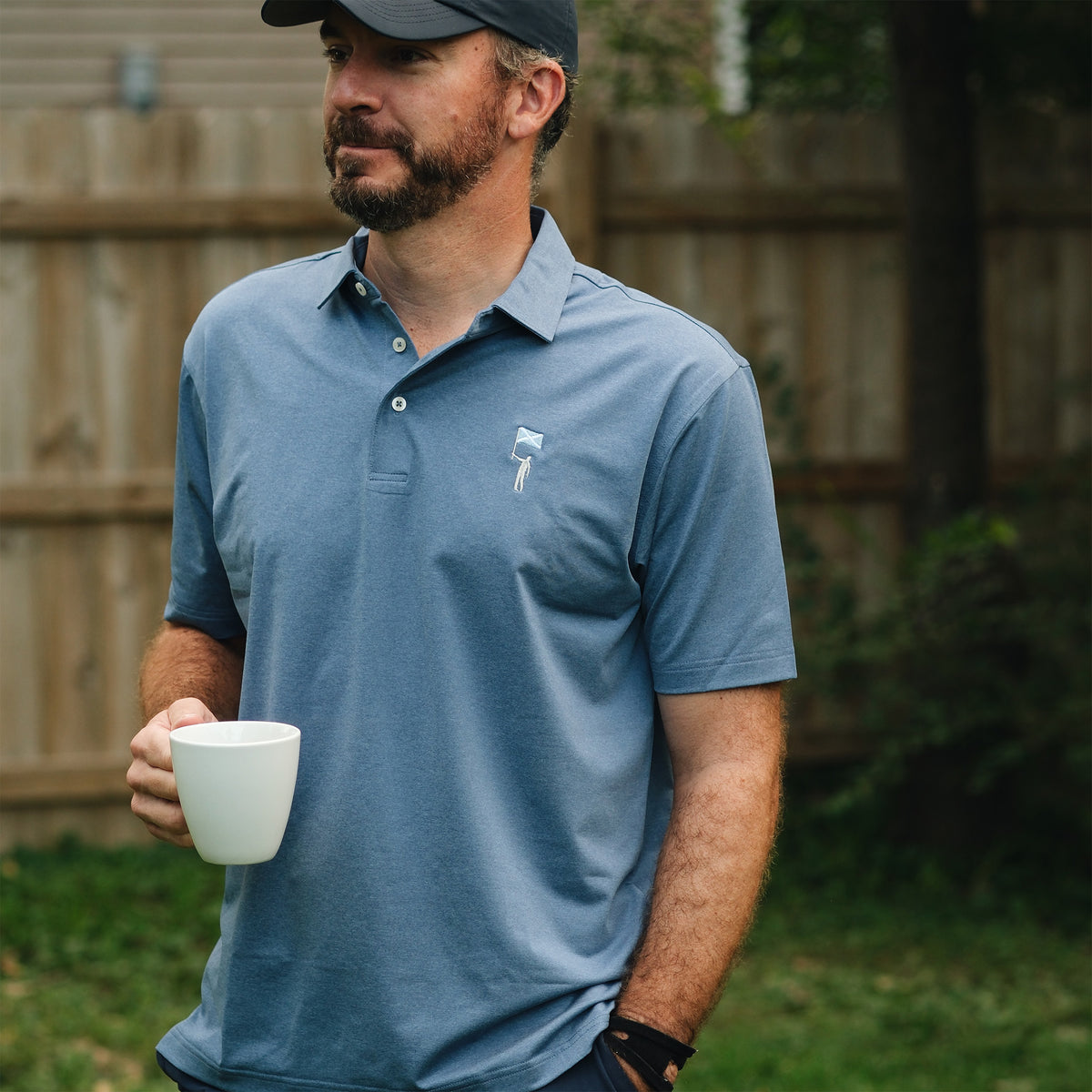 NLU x Rhoback Heathered Performance Polo | Coastal Blue Tourist Sauce Edition
